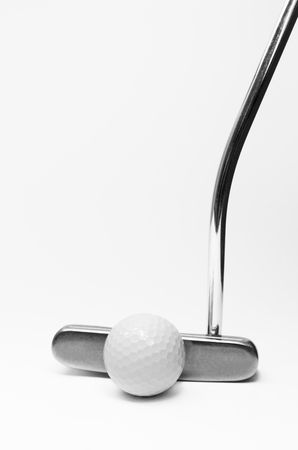 Golf club and white golf ball isolated on a white の写真素材