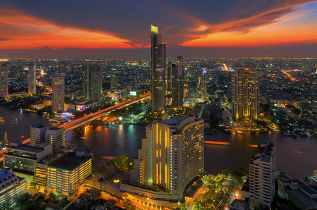 Landscape modern building near the river at sunset in Bangkok view of the bird.の写真素材