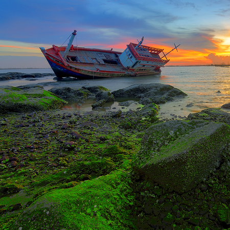 Seascape with old derelict fishing boat の写真素材