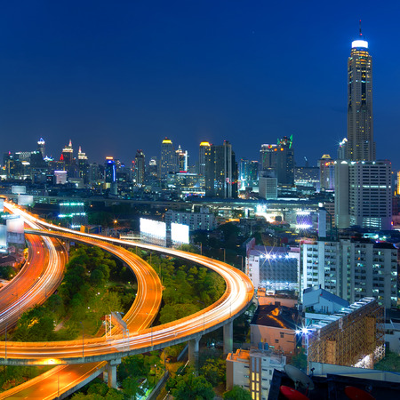 Building the business district in the evening Front elevation curves of the highway bridge in Bangkok.の写真素材