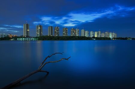 Modern buildings at twilight with reflection.の写真素材