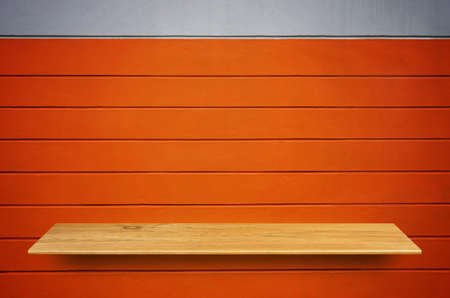Top wooden shelves and concrete wall background - For product display.の写真素材