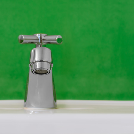 faucet on the sink, ceramic white.の写真素材
