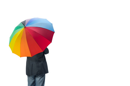 The businessman behind the stand under colorful umbrella isolated on white background with clipping path.の写真素材