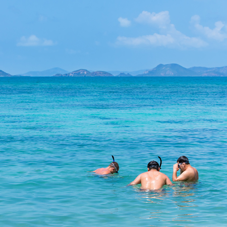 Tourists are diving to see the coral reefs, coastal Koh Kham, Chonburi, Thailand.の写真素材