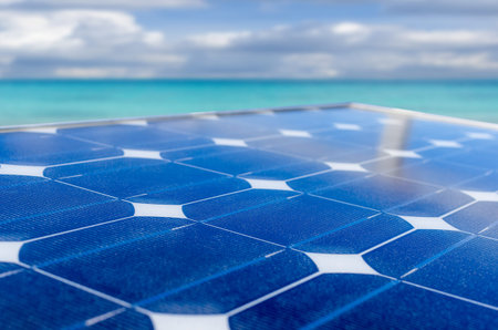 Solar panel on the lighthouse with blurred sea.