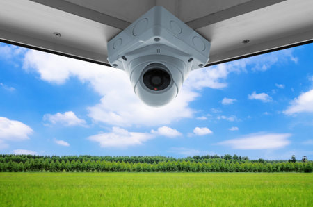 The security cameras on a balcony high building. CCTV view clear sky
