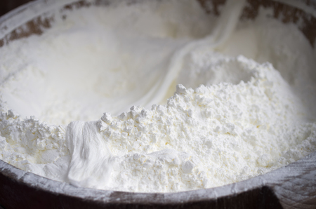 Wheat flour in wooden barrels. Prepared for baking.の写真素材