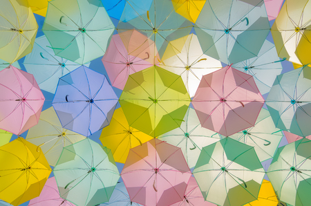 A lot of multicolored umbrellas. Color umbrellas urban decoration.の写真素材