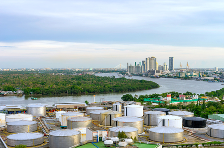 Oil storage tanks in the industrial district along the river. Background building business district. Bangkok suburbsの写真素材