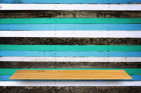 Top wooden shelves and wooden wall background - For product display.の写真素材