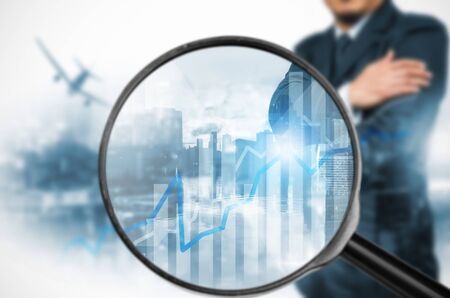 Examining business with magnifying glass, concept examining.の写真素材