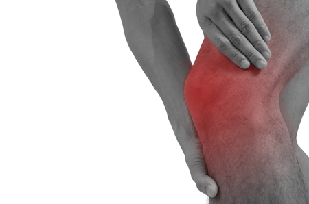 Men with pain in his knee isolated on white with clipping path.の写真素材