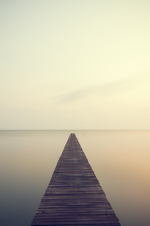 wooden bridge leading to the mangrove forest bridge sea.の写真素材