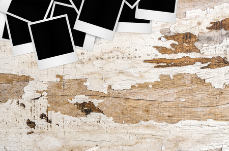 Blank photo frame on wooden background with clipping path.の写真素材