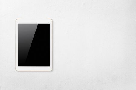 Digital tablet computer with isolated screen with clipping path on white concrete background.の写真素材