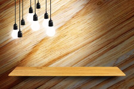 Bookshelf on the wall with lamp - For product display.の写真素材