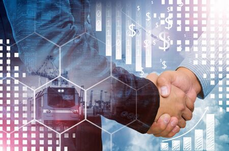 Double exposure of businessman handshake on industrial business background and financial graph.の写真素材