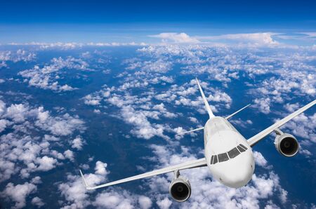 Airplane flying high above the clouds.の写真素材