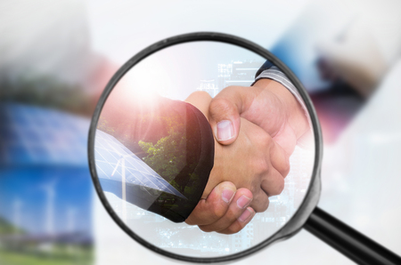 Examining business with magnifying glass, concept examining.の写真素材