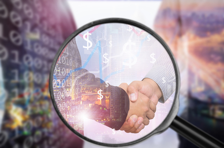 Examining business with magnifying glass, concept examining.の写真素材