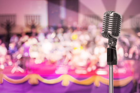 Vintage microphone on wall blurred background.の写真素材