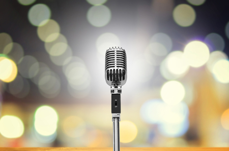 Vintage microphone on wall blurred background.の写真素材