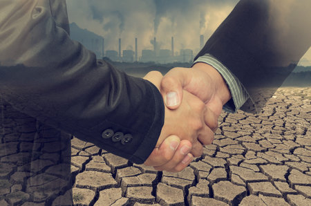 Abstract of handshake agreement to protect the environment, Global warming.の写真素材