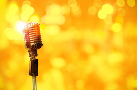 Vintage microphone on wall blurred background.の写真素材
