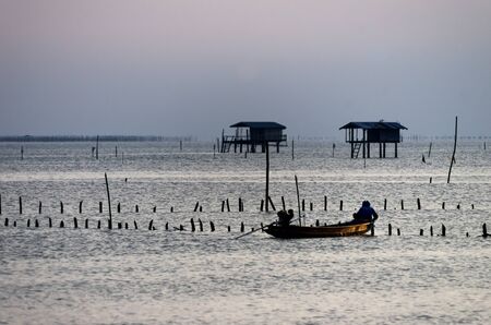 Silhouette fishing boat bang tabun Phetchaburi, Thailand.の写真素材