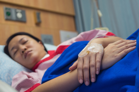Close-up of hands patient received saline via cable in the patient rooms.の写真素材