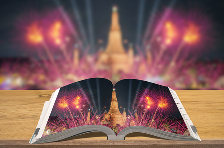 Creativity guidebooks travel, Open book on wooden table with blurred nature background, Scene Wat Arun.の写真素材