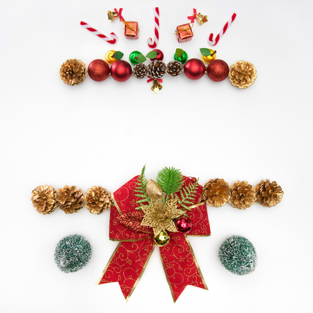 Christmas background with gift box, fir tree, conifer cone, christmas ball, christmas wreath, New Year's interior and holiday decorations on white from above. Flat lay style.の写真素材