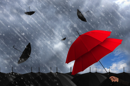 Insurance agent holding red umbrella two layers to protect the life, health, savings, investment and accident, Insurance concept.の写真素材