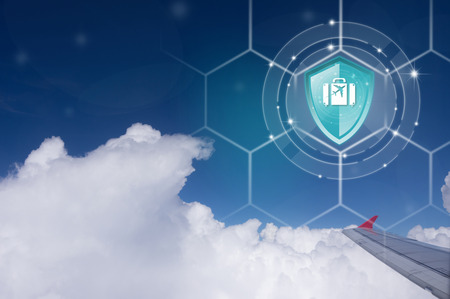 Travel Insurance, Shield protection Travel on virtual screen against Traveler on backdrop, Concept of insurance, Online insurance digital technology.の写真素材