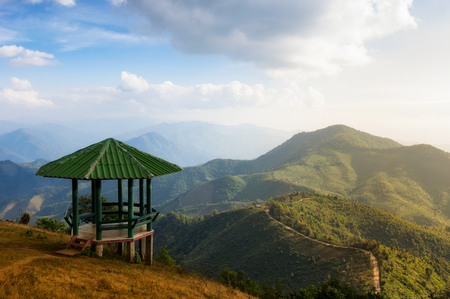 The scenic landscape of high mountains in the evening with Pavilion, viewpoint foreground, on top viewpoint mountain Doi Pui Cu, Popular tourist attraction in Mae Hong Son, Thailand.の写真素材