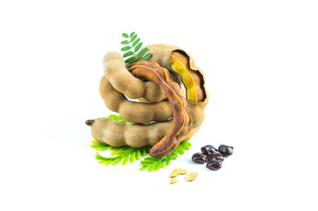Fresh sweet tamarind isolated on  white background with leaves, seeds and bark of tamarind, Can be used as a health drink, tamarind juice.の写真素材