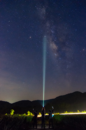 Milky Way galaxy over Mountain landscape with star hunter, Phu Sawan reservoir Phetchaburi Thailand.の写真素材