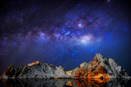 Milky Way over Mountain landscape, Reine village in Lofoten islands of Norway.の写真素材