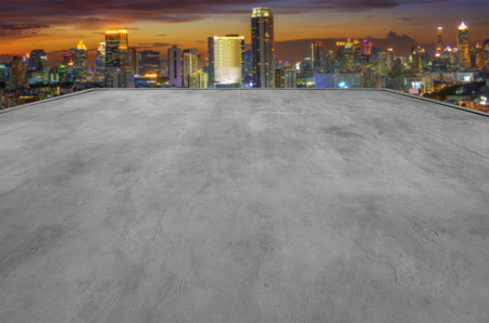 Empty rooftop of the building is perfect for showcase with modern cityscape background.の写真素材
