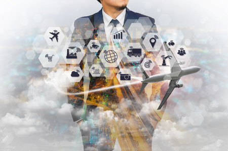 Double exposure of businessman with Internet of things (IOT) objects icon connecting together, Internet networking concept, Connect global wireless devices with each other.の写真素材