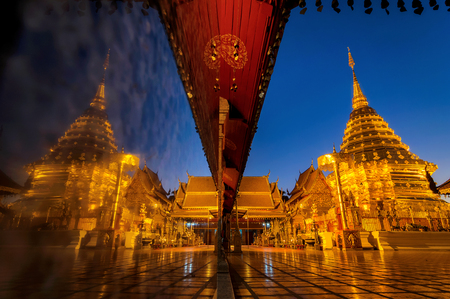 Wat phra that doi suthep temple in Chiang mai thailand, the most famous temple at twilight. Beautiful Pagoda with reflection.の写真素材