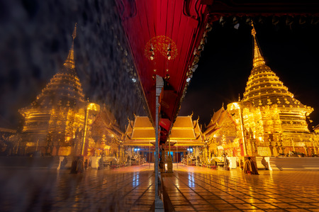Wat phra that doi suthep temple in Chiang mai thailand, the most famous temple at twilight. Beautiful Pagoda with reflection.の写真素材