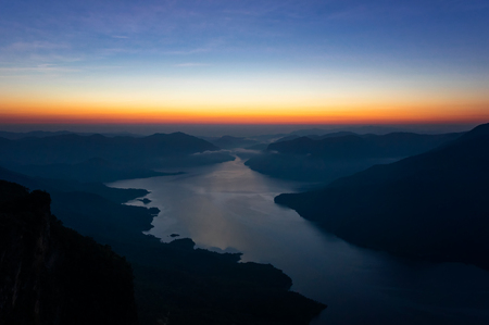 Landscape mountain scenery and water in the dam at sunrise on mountain pha daeng luang, Mae Ping National Park.の写真素材