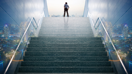 Double exposure businessman climbed on top of the stairs going to the city,  Ambitions concept and Success business.の写真素材