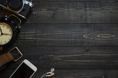 Planning for trip set of travel accessory on wooden background top view,in vintage tone style copy space.の写真素材