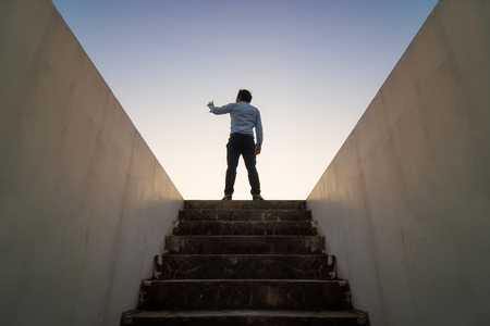 Businessman climbed on top of the stairs, Ambitions concept and Success business.の写真素材