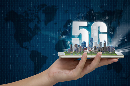 5G network wireless systems and internet of things, Smart city and communication network on smartphone in hand and objects icon connecting together,  Connect global wireless devices.の写真素材