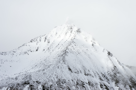 Mountain snow in Reine on the Lofoten Islands in Norway, Beautiful view of scenic Lofoten Islands archipelago winter scenery, Beautiful mountain landscape in winter Norway, Scandinavia.の写真素材