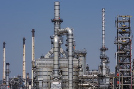 Pipes, chimneys of oil refinery. With the sky as a backdrop.の写真素材